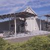 Structures were made of steel to resist harsh weather and high winds.  Workshop under construction can be seen to the right of winery.