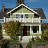 Street view shows covered porch with master bedroom terrace above.   We restored front stair with flanking pylons that connect to watertable and mahogany treads for durability.