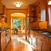 View is of new galley kitchen looking toward mudroom and bay window.