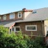 Similar view after renovation shows new shed roof dormer that enclosed  two bathrooms and master closet.